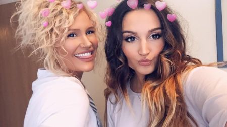 Chelsey Grace in left poses a picture with close friend.